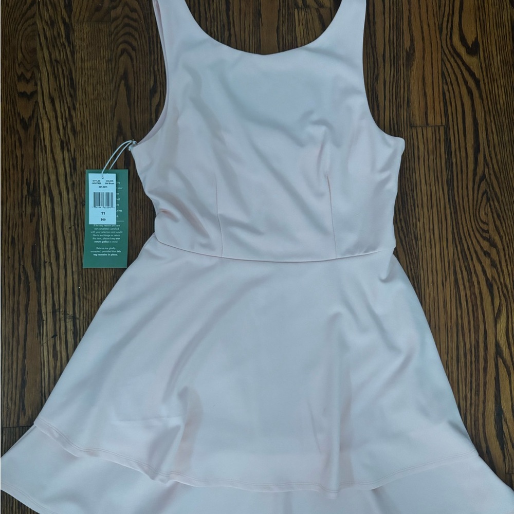 Sleeveless light pink skater dress